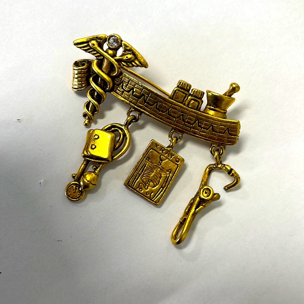 Vintage Brass medical pin in excellent condition with a crystal 2 1/4” x 2”